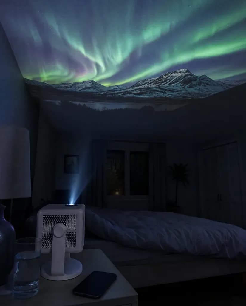The Cineva One tilted up on its stand, throwing a picture onto the bedroom ceiling